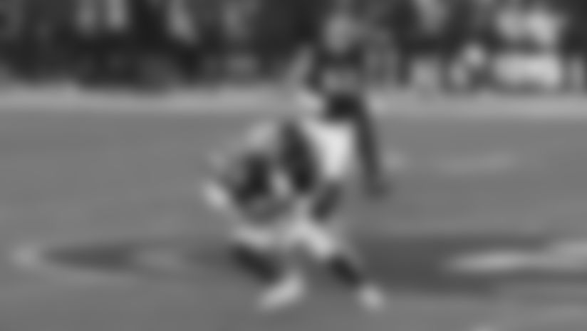 Bears defensive end Austin Booker takes down San Francisco 49ers quarterback Brock Purdy.