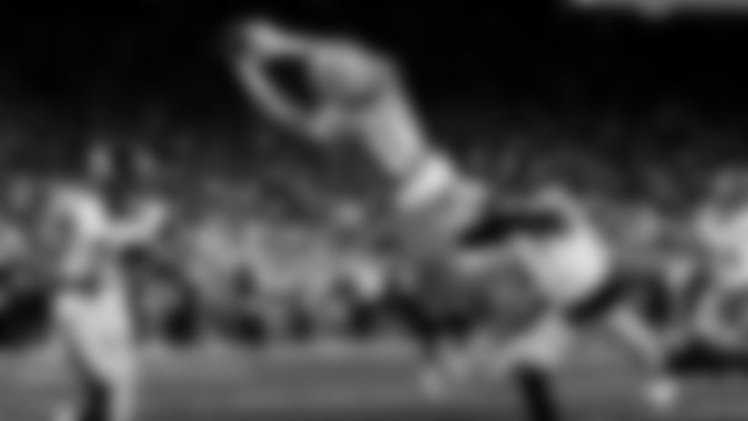 Detroit Lions quarterback Jared Goff threads the needle between two Pittsburgh Steelers defenders and into the hands of Lions wide receiver Isaac TeSlaa.