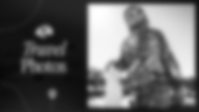 Browse photos of Los Angeles Rams players loading onto the team plane as they head to the East Coast for their Wild Card matchup against the Carolina Panthers.