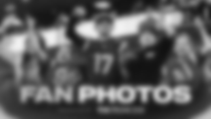 Browse through photos of fans meeting Santa, posing with their Corona holiday sweaters, and bringing a festive cheer to SoFi Stadium for the Los Angeles Rams' Week 15 win over the Detroit Lions.