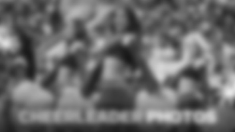 Browse through photos of Los Angeles Rams cheerleaders arriving to SoFi Stadium, dancing on the field throughout the matchup, and smiling backstage before game time.