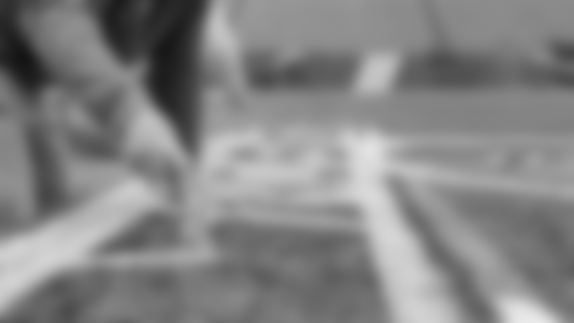 Watch as the Patriots home turf gains a new emblem ahead of their Divisional playoff matchup against the Texans.