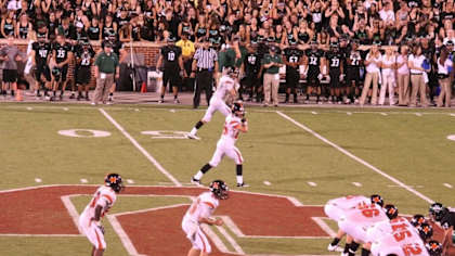 No. 9 George Kittle and No. 25 Brandon Minto during a Norman High School football matchup.