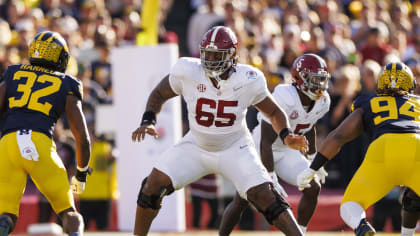 Alabama offensive lineman JC Latham (65) blocks during the Rose Bowl CFP NCAA semifinal college football game against Michigan, Monday, Jan. 1, 2024, in Pasadena, Calif. Michigan defeated Alabama in overtime, 27-20. (Ryan Kang via AP)