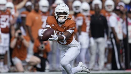 Texas wide receiver Adonai Mitchell (5) reaches for a pass during the first half of an NCAA college football game against Kansas State in Austin, Texas, Saturday, Nov. 4, 2023. (AP Photo/Eric Gay)