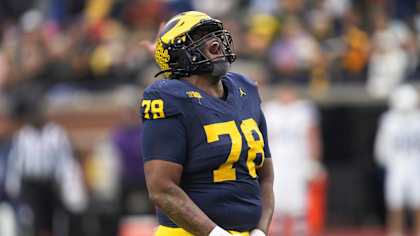 Michigan defensive lineman Kenneth Grant (78) celebrates sacking Northwestern quarterback Jack Lausch (12) in the first half of an NCAA college football game in Ann Arbor, Mich., Saturday, Nov. 23, 2024. (AP Photo/Paul Sancya)