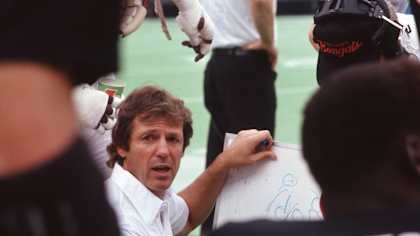 Cincinnati Bengals defensive coordinator Dick LeBeau meets with his defense during a game against the Houston Oilers in Cincinnati, OH, Nov. 1, 1987. The Oilers defeated the Bengals 31-29. (Paul Spinelli via AP)