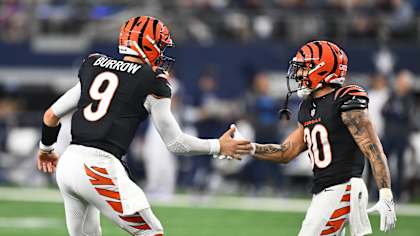 QB Joe Burrow and RB Chase Brown celebrate their second-quarter touchdown. against the Cowboys in Dallas, Monday, December 9, 2024.