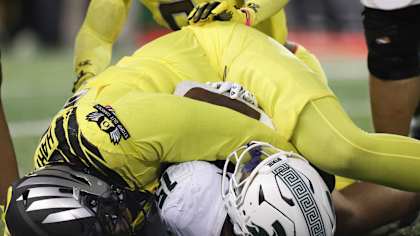 Michigan State running back Kay'Ron Lynch-Adams, right, scores a touchdown while being tackled by Oregon defensive lineman Derrick Harmon (55) during the second half of an NCAA college football game, Friday, Oct. 4, 2024, in Eugene, Ore. (AP Photo/Amanda Loman)