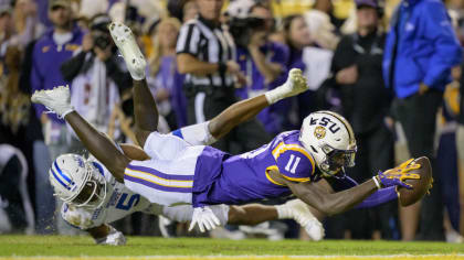 LSU wide receiver Brian Thomas Jr. (11) stretches to break the plane of the end zone for a touchdown against Georgia State cornerback Bryquice Brown (5) during the first half of an NCAA college football game in Baton Rouge, La., Saturday, Nov. 18, 2023. (AP Photo/Matthew Hinton)