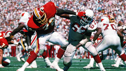 Cardinals tackle Luis Sharpe (67) battles Washington defensive end Dexter Manley in a game at Sun Devil Stadium during the Cardinals' first season in Arizona.