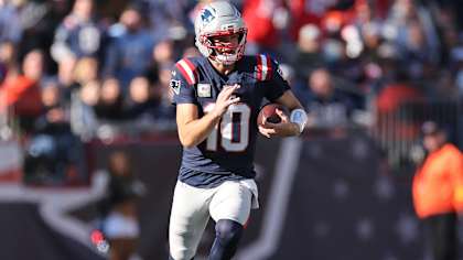 Drake Maye escapes heavy pressure for a 12-yard gain