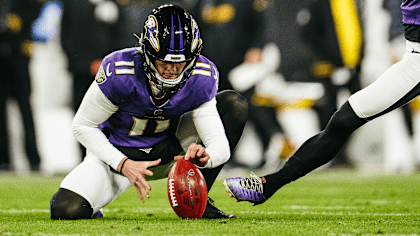 Jordan Stout holding for a kick.