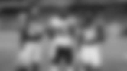 Ruben Hyppolite II with college teammate Glendon Miller (left) and high school teammate Kevin Knowles II (right)