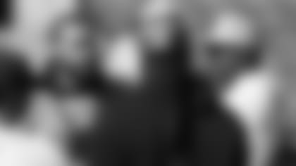 Montez Sweat talks with NFC defensive coordinator and Hall of Famer DeMarcus Ware during NFC practice.