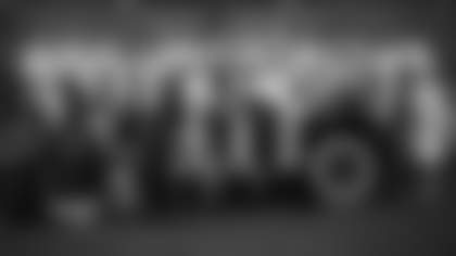 Virginia Halas McCaskey seated in a Hupmobile surrounded by other NFL owners at the league's annual meeting in Phoenix in 2019.