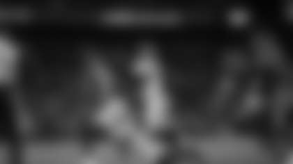 DE Joseph Ossai hits Lamar Jackson as DE Cedric Johnson recovers the fumble during Week 13 against the Baltimore Ravens, Thursday, Nov. 27, 2025.