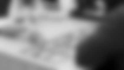 Arizona Cardinals offensive lineman Kelvin Beachum (68) meets with Scout, the artist painting his My Cause My Cleats, on Thursday, Oct 31, 2024 in Mesa, AZ.