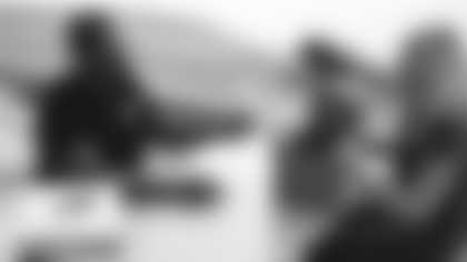 Arizona Cardinals offensive lineman Kelvin Beachum (68) meets with Scout, the artist who painted his My Cause My Cleats, on Monday, Nov 11, 2024 in Tempe, AZ.