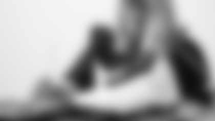 Scout Rooney works on painting the My Cause My Cleats for Arizona Cardinals offensive lineman Kelvin Beachum (68) on Tuesday, Nov 5, 2024 in Mesa, AZ.