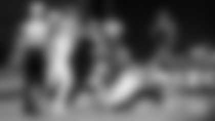 Cardinals defenders Calais Campbell (93) and Budda Baker combine for a sack of Jaguars quarterback Trevor Lawrence during Sunday's game at State Farm Stadium.