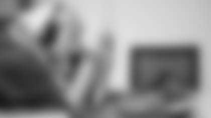 Scout Rooney works on painting the My Cause My Cleats for Arizona Cardinals offensive lineman Kelvin Beachum (68) on Thursday, Nov 7, 2024 in Mesa, AZ.