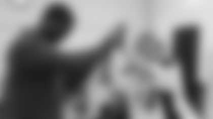 Arizona Cardinals offensive lineman Kelvin Beachum (68) meets with Scout, the artist painting his My Cause My Cleats, on Thursday, Oct 31, 2024 in Mesa, AZ.