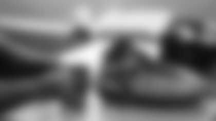 Arizona Cardinals offensive lineman Kelvin Beachum (68) meets with Scout, the artist who painted his My Cause My Cleats, on Monday, Nov 11, 2024 in Tempe, AZ.