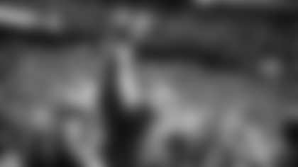 Johnson lifts teammate Marvin Harrison Jr. after a Harrison touchdown last season.