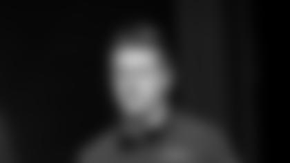 New York Jets offensive coordinator Mike Lafleur walks on to the field before a NFL football game against the Miami Dolphins, Sunday, Dec. 19, 2021, in Miami Gardens, Fla. (AP Photo/Doug Murray)