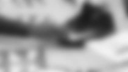 Arizona Cardinals offensive lineman Kelvin Beachum (68) meets with Scout, the artist painting his My Cause My Cleats, on Thursday, Oct 31, 2024 in Mesa, AZ.