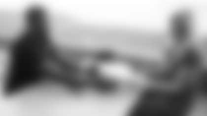 Arizona Cardinals offensive lineman Kelvin Beachum (68) meets with Scout, the artist who painted his My Cause My Cleats, on Monday, Nov 11, 2024 in Tempe, AZ.