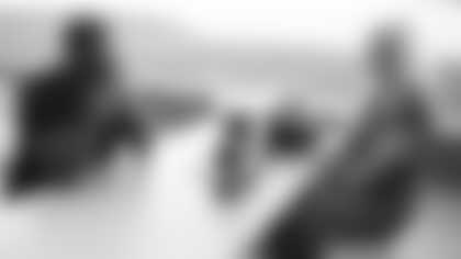 Arizona Cardinals offensive lineman Kelvin Beachum (68) meets with Scout, the artist who painted his My Cause My Cleats, on Monday, Nov 11, 2024 in Tempe, AZ.