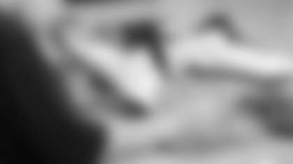 Scout Rooney works on painting the My Cause My Cleats for Arizona Cardinals offensive lineman Kelvin Beachum (68) on Tuesday, Nov 5, 2024 in Mesa, AZ.