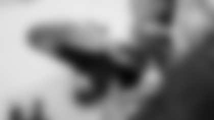 Scout Rooney works on painting the My Cause My Cleats for Arizona Cardinals offensive lineman Kelvin Beachum (68) on Thursday, Nov 7, 2024 in Mesa, AZ.