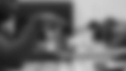 Arizona Cardinals offensive lineman Kelvin Beachum (68) meets with Scout, the artist painting his My Cause My Cleats, on Thursday, Oct 31, 2024 in Mesa, AZ.