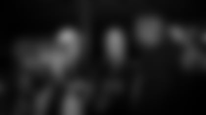 Mason and Loren Payne (21 jersey) chat with Patrick Peterson.