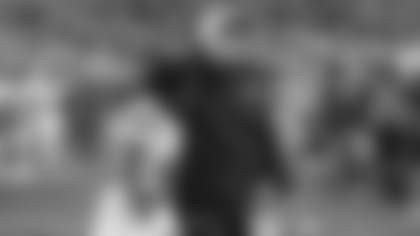 Then-Jets offensive coordinator Nathaniel Hackett walks off the field after a 2023 win with running back Michael Carter, who is now with the Cardinals.