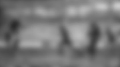 Sam Baugh, passing star of the Washington Redskins, flips an aerial for a 12-yard gain during the Redskins’ 49-14 rout of the New York Giants on Dec. 6, 1937 in New York. Baugh, being tackled by Ray Hanken (37) of the Giants a moment after getting the ball away, completed 11 passes for a total gain of 135 yards and ran his total completions for the regular season to 81, a new national league record. (AP Photo)