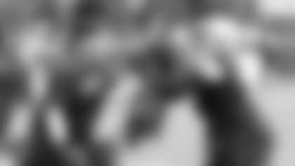 Dallas Cowboys defensive coordinator Dan Quinn (left) works with defensive tackle Osa Odighizuwa (75) during an NFL football training camp Tuesday, July 27, 2021 in Oxnard, Calif. (James D Smith via AP)