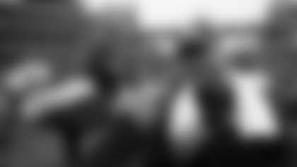 Seattle Seahawks outside linebacker Mike Morgan (57) celebrates with Seattle Seahawks linebackers coach Ken Norton, Jr. after winning the NFL week 20 NFC Championship football game against the Green Bay Packers on Sunday, Jan. 18, 2015 in Seattle. The Seahawks won the game 28-22 in overtime. (AP Photo/Paul Spinelli)