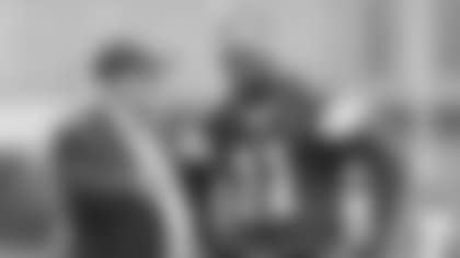 Dallas Cowboys owner Jerry Jones (left) talks with linebacker Micah Parsons (11) during the team's NFL football practice, Tuesday, June 10, 2025 in Frisco, Texas. (James D. Smith via AP)