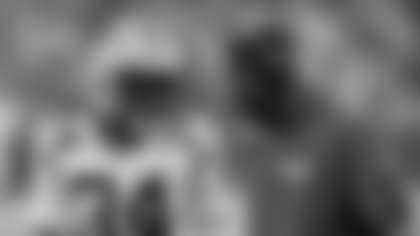 Green Bay Packers cornerback Kalen King (34) talks to defensive passing game coordinator Derrick Ansley during an NFL preseason football game against the Indianapolis Colts, Saturday, Aug. 16, 2025, in Indianapolis. (Joe Robbins via AP)