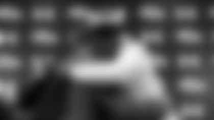 Quarterback Lamar Jackson, right, one of the Baltimore Ravens' first-round draft picks, hugs head coach John Harbaugh during an NFL football news conference at the team's headquarters in Owings Mills, Md., Friday, April 27, 2018. (AP Photo/Patrick Semansky)