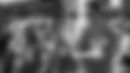 New York Giants quarterback Eli Manning (10) jokes around with New York Jets center Nick Mangold (74) at the NFL Pro Bowl football draft at Wheeler Army Airfield, Wednesday, Jan. 27, 2016, in Wahiawa, Hawaii. (AP Photo/Marco Garcia)