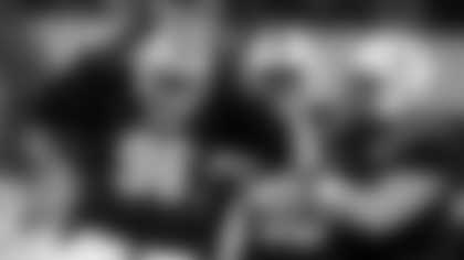 East's Tonka Hemingway (96), of South Carolina, celebrates with Nash Hutmacher, right, of Nebraska, after sacking West's Brady Cook, bottom left, of Missouri, in the first half of the East West Shrine Bowl NCAA college football game in Arlington, Texas, Thursday, Jan. 30, 2025. (AP Photo/Tony Gutierrez)