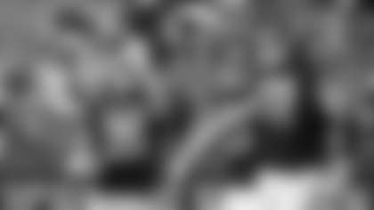 Northwestern running back Evan Hull (26) celebrates his touchdown against Southern Illinois with tight end Charlie Mangieri (89) and offensive lineman Caleb Tiernan (72) during the first half of an NCAA college football game Saturday, Sept. 17, 2022, in Evanston, Ill. (AP Photo/Matt Marton