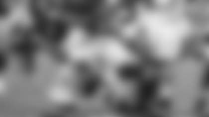 Miami defensive back Keionte Scott (0) and defensive back Bryce Fitzgerald (13) defend Indiana running back Kaelon Black during the first half of a College Football Playoff national championship game, Monday, Jan. 19, 2026, in Miami Gardens, Fla. (AP Photo/Lynne Sladky)