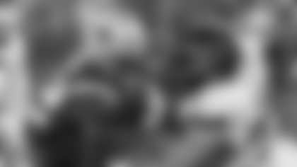 New England Patriots running back Treveyon Henderson (32) is tackled by Houston Texans defensive tackle Tommy Togiai (72) during the second half of an NFL divisional playoff football game, Sunday, Jan. 18, 2026, in Foxborough, Mass. (AP Photo/Greg M. Cooper)