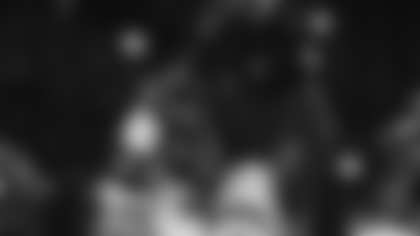 Miami offensive lineman Markel Bell holds up a trophy after winning the Fiesta Bowl NCAA college football playoff semifinal game against Mississippi, Thursday, Jan. 8, 2026, in Glendale, Ariz. (AP Photo/Ross D. Franklin)